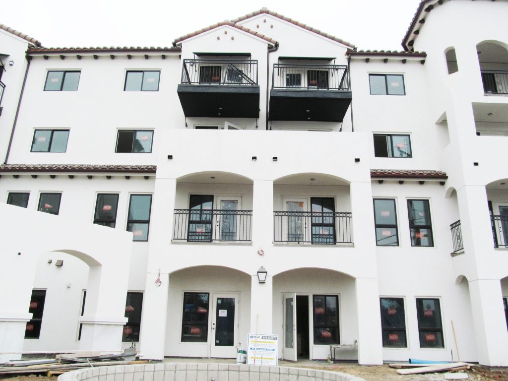 two types of balcony with wrought iron railings