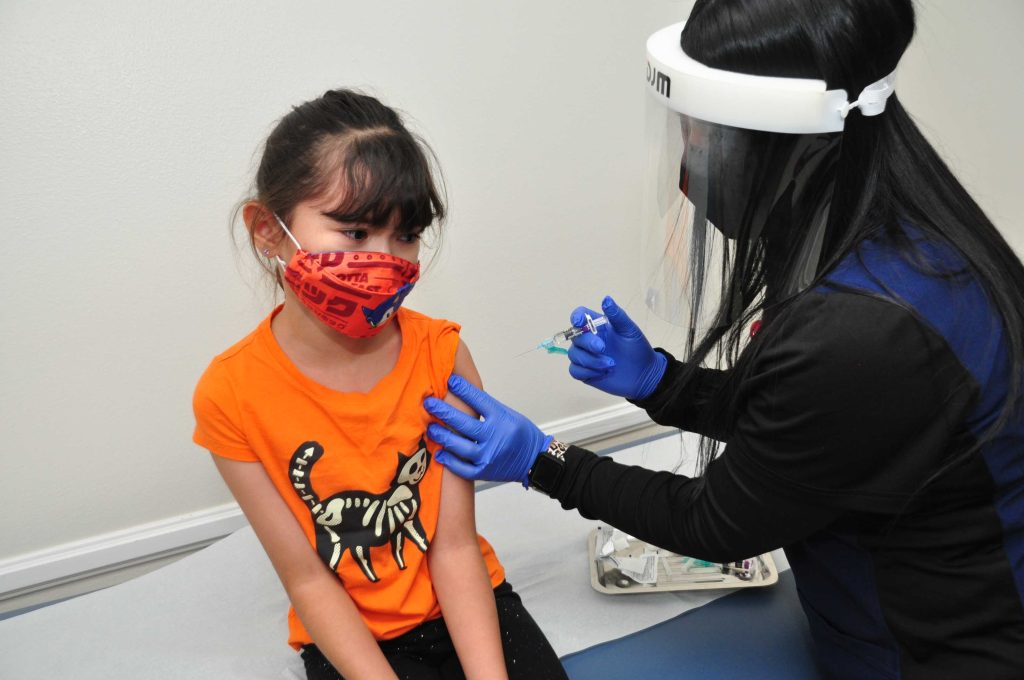 Patient Jasmine Cruz of Fontana age 8 with Nurse Megan. Whether your child is starting kindergarten or is a senior in high school, visiting the pediatrician for immunizations should be an important part of back-to-school preparations. Many schools start in August, so it’s not too soon to make that appointment.