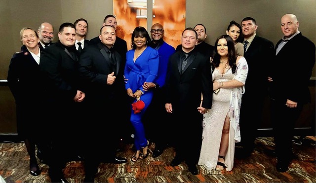 Photo Caption: Graduates family and Salvation ARC Officers join to celebrate the men’s graduation from the eight-session course covering life skills, leadership and etiquette.